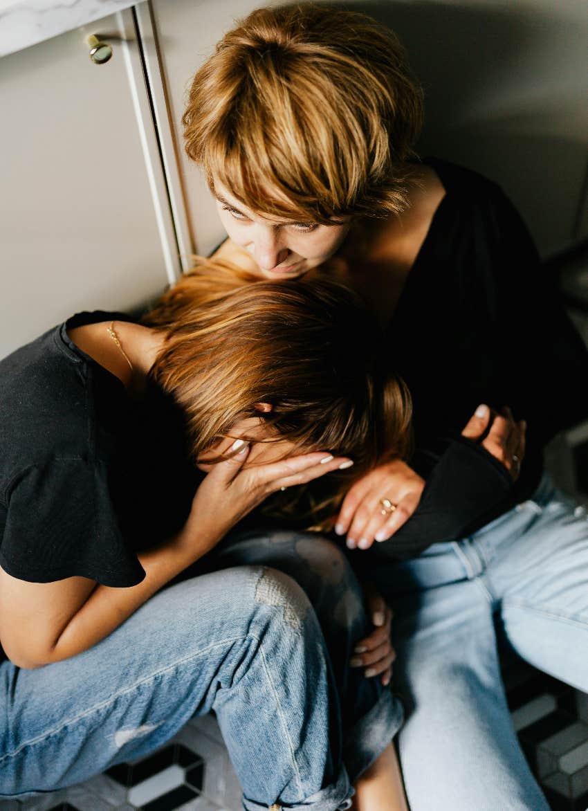 sisters crying and sitting together