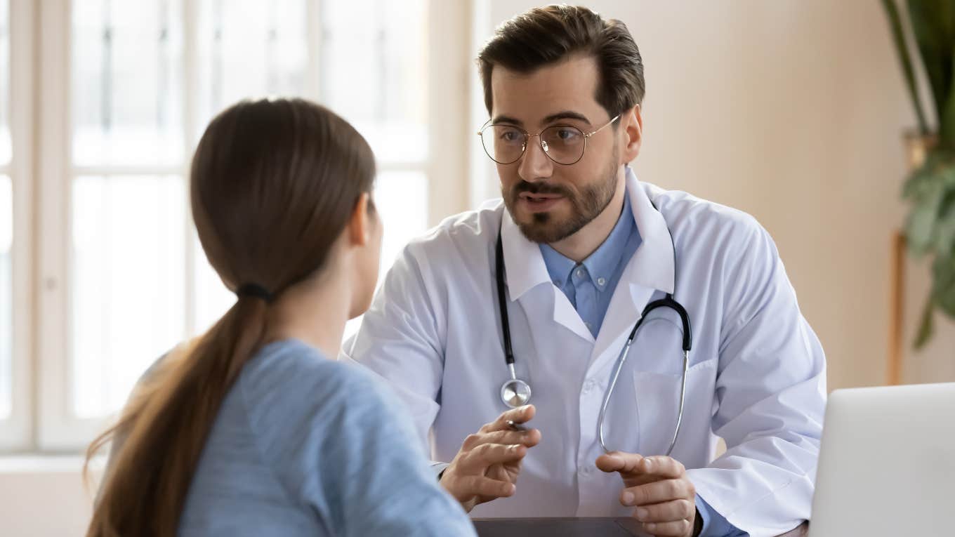 male doctor in white medical uniform talk discuss results or symptoms with female patient