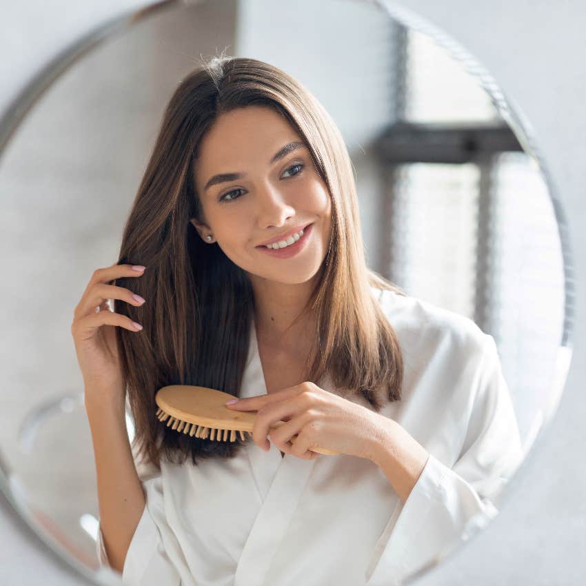 Woman bushing her hair