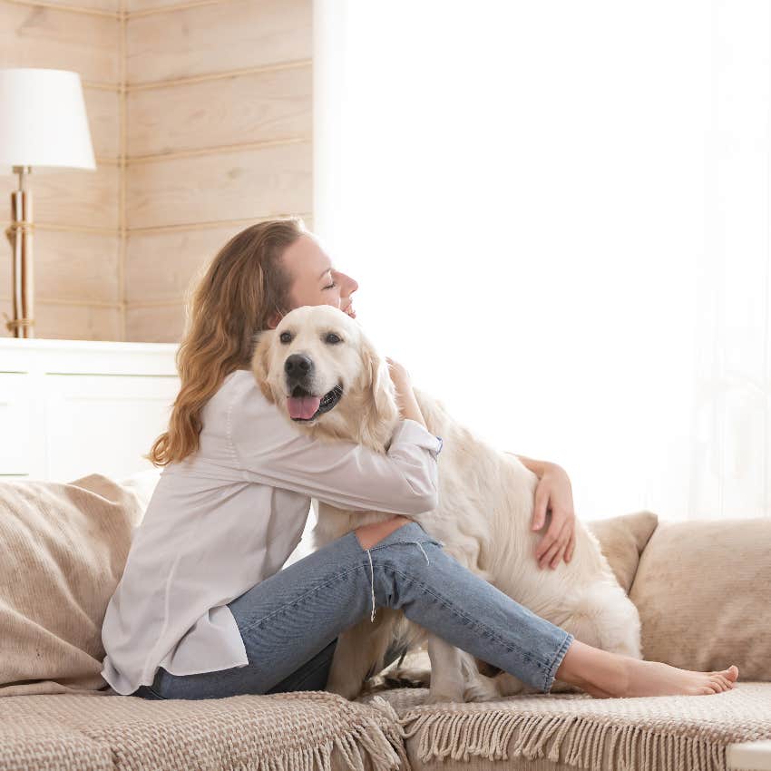 Woman hugging dog