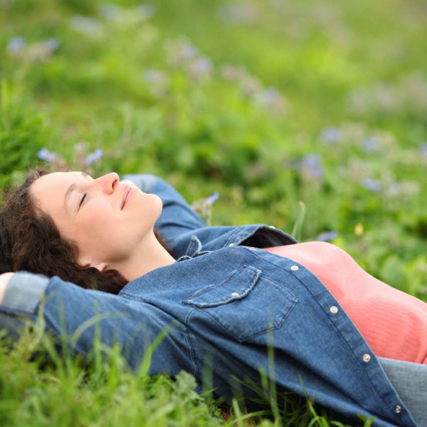 woman laying in the grass