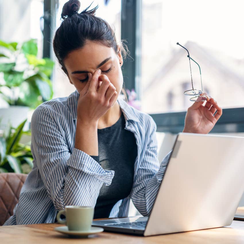 Woman stressed and overwhelmed at work