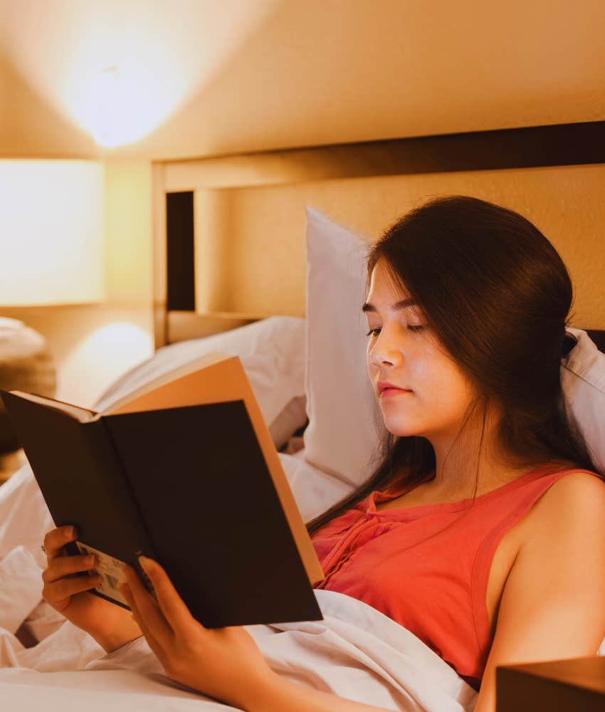 woman reading in bed quietly
