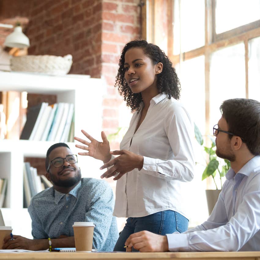 woman speaking up in work meeting