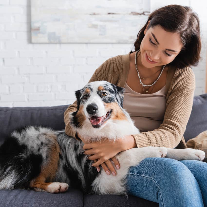 Woman with dog on couch