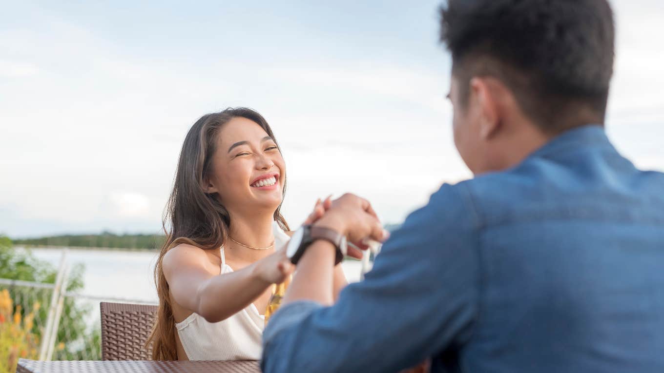 woman on date with man whose face can't be seen