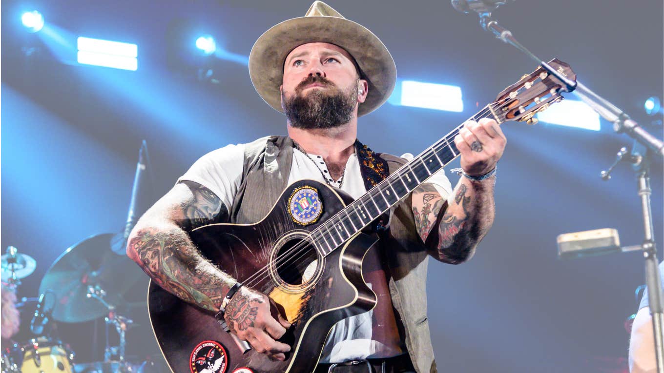 Singer Zac Brown standing on stage with guitar. 