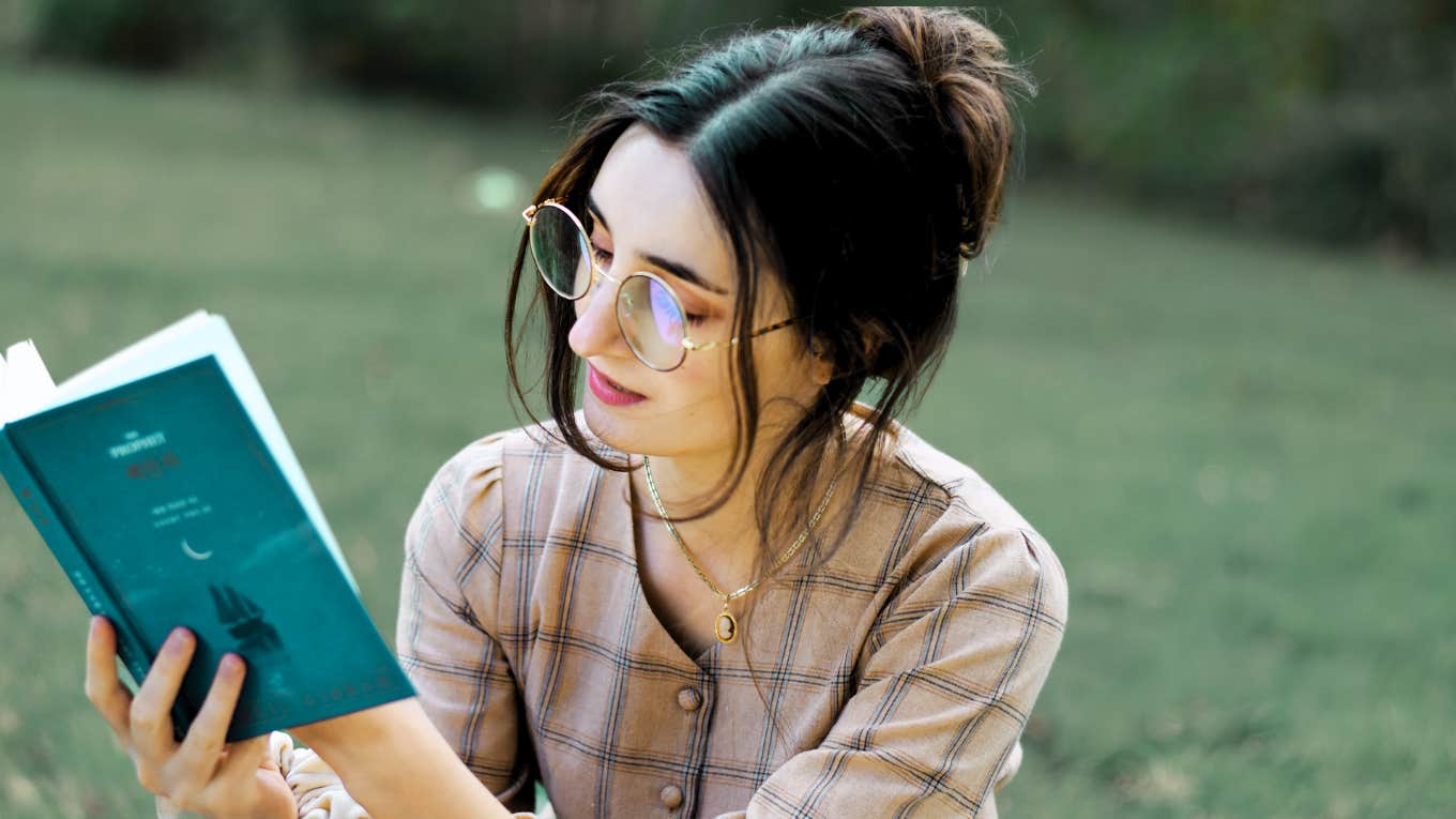 Spirituality Helped Me Manage Post-Traumatic Stress Disorder Woman reading outside, managing her Post-Traumatic Stress Disorder, healing with spirituality.