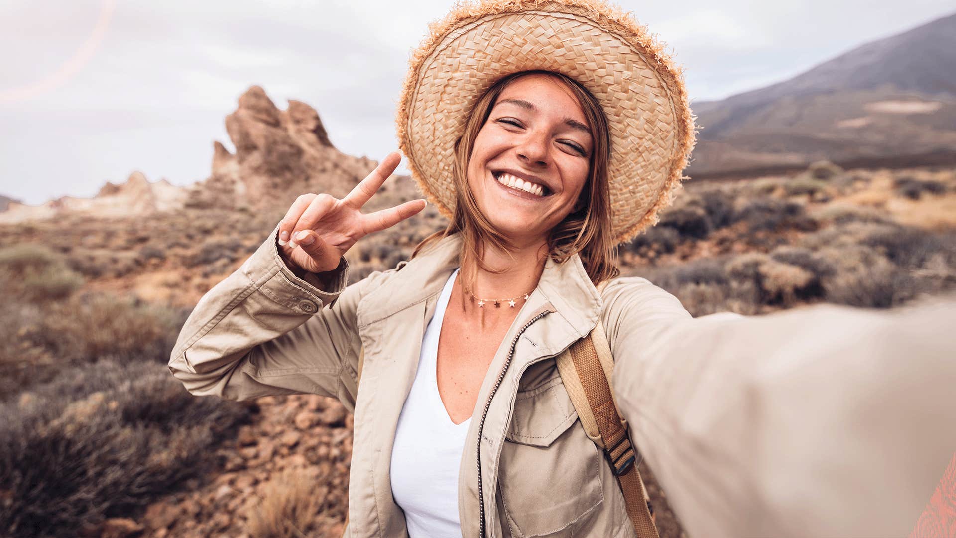 happy woman taking a selfie outdoors