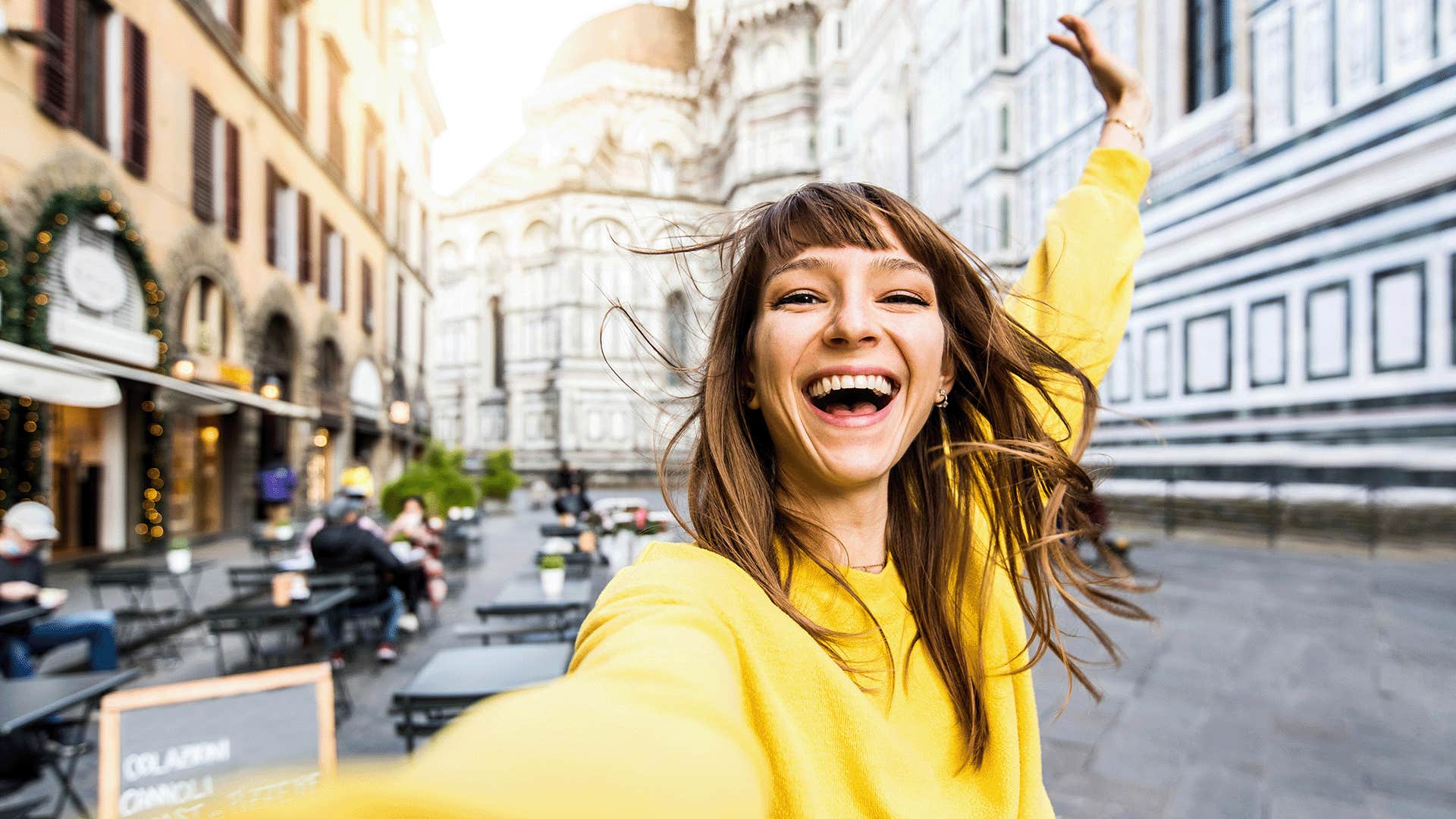 happy woman taking a selfie outdoors