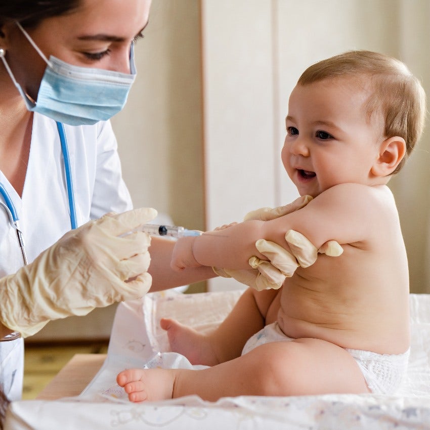 Baby getting a shot at the doctor