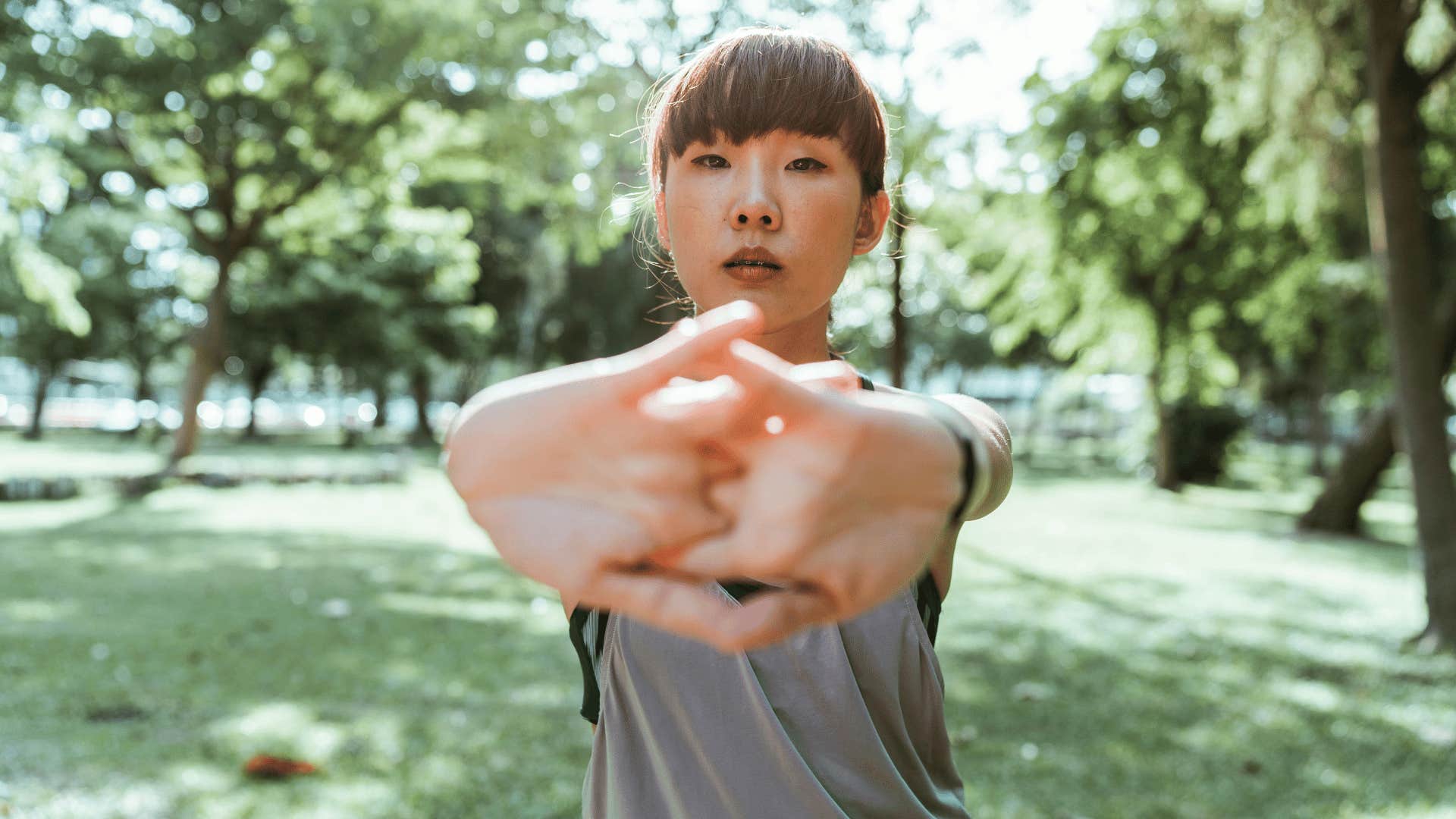 woman stretching arms out
