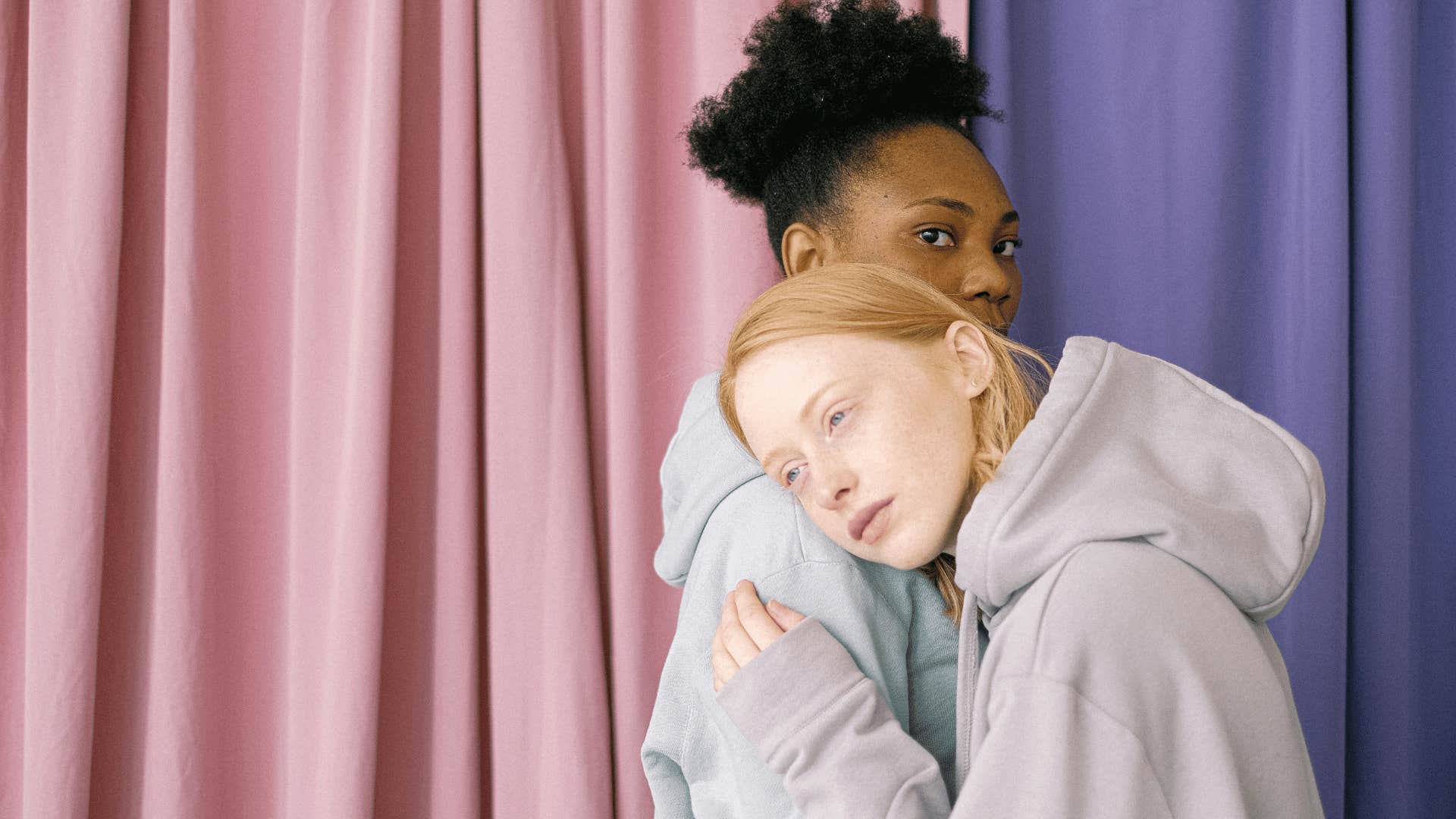 friends comforting each other