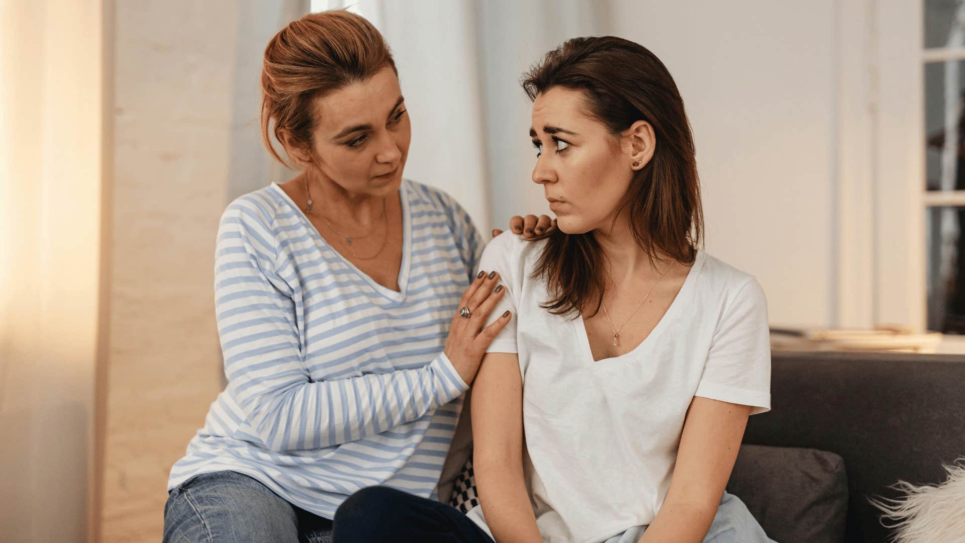 woman comforting her friend
