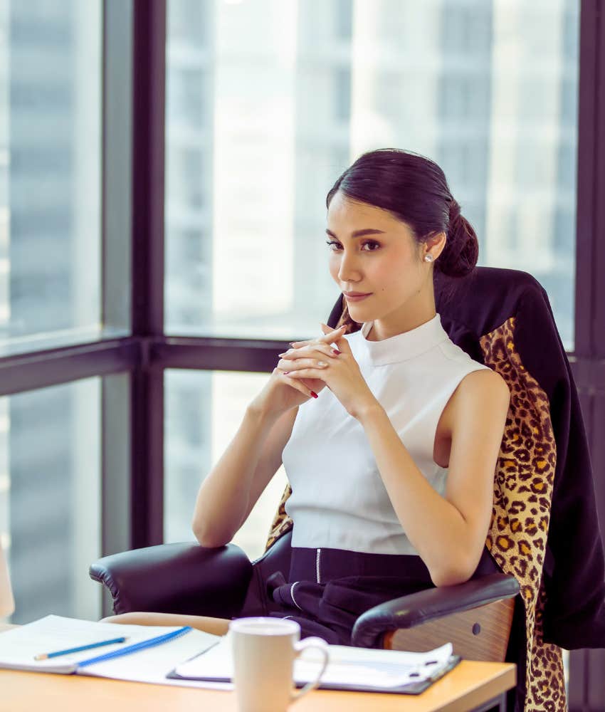 boss sitting in corner office