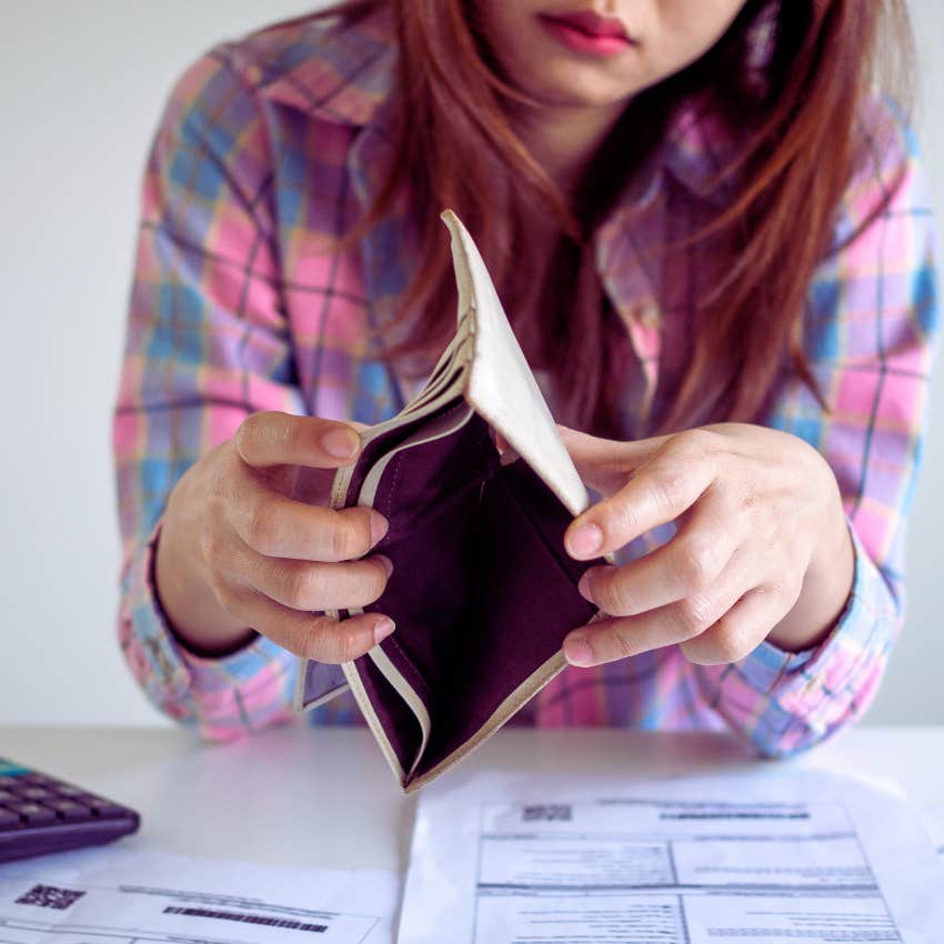 young broke woman trying to pay bills