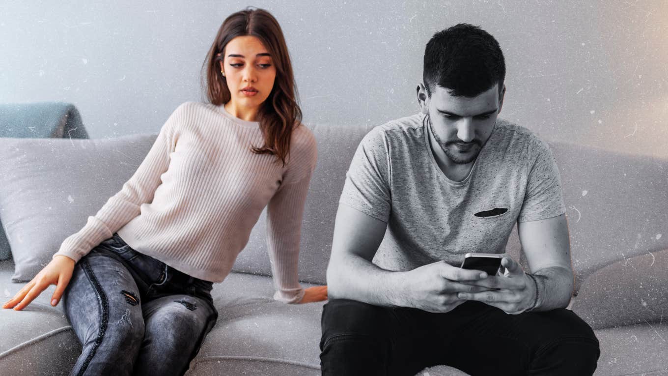 Woman peeking over at partners phone, trust issues 