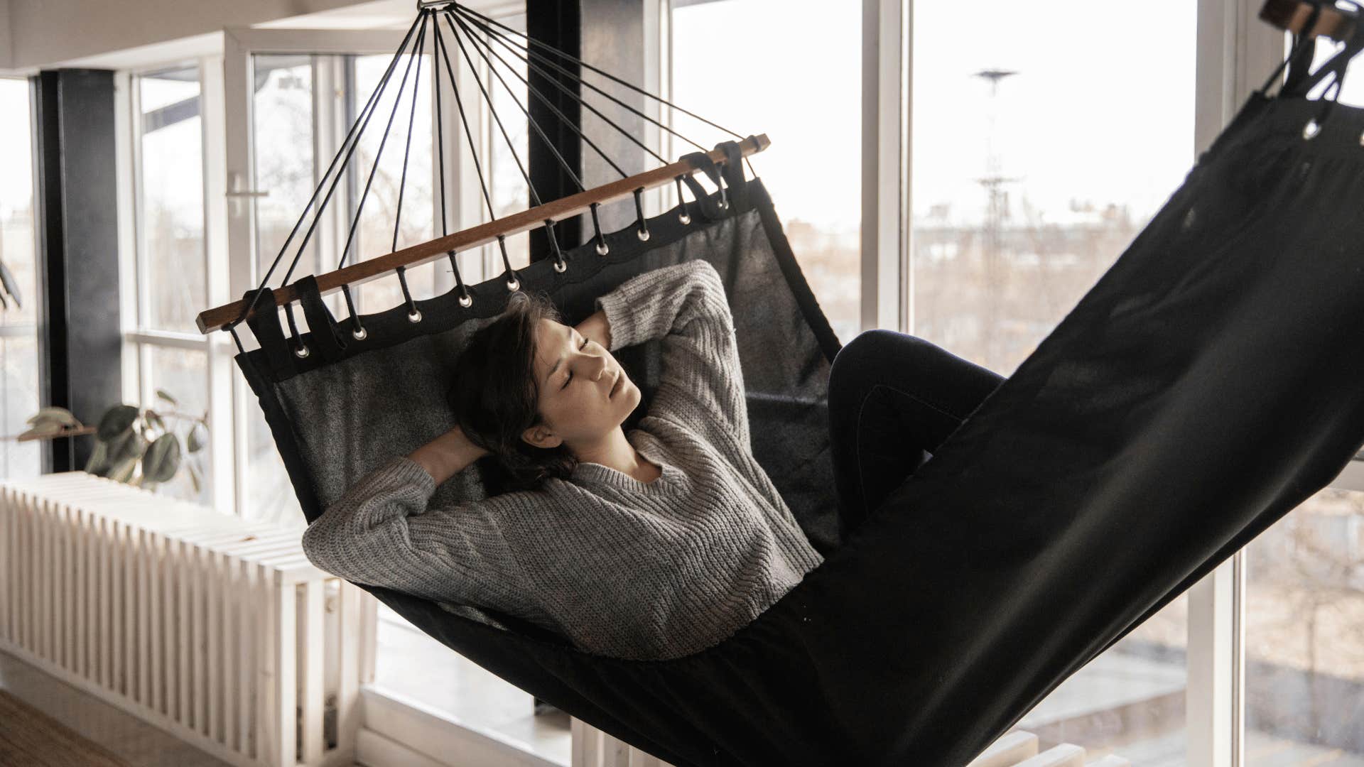 woman taking nap in hammock