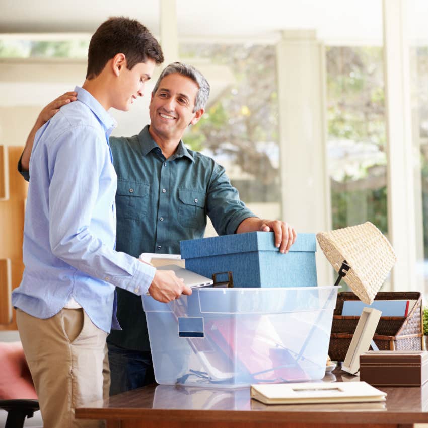 proud dad helps son pack for college