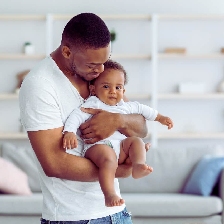 dad holding his baby in his arms