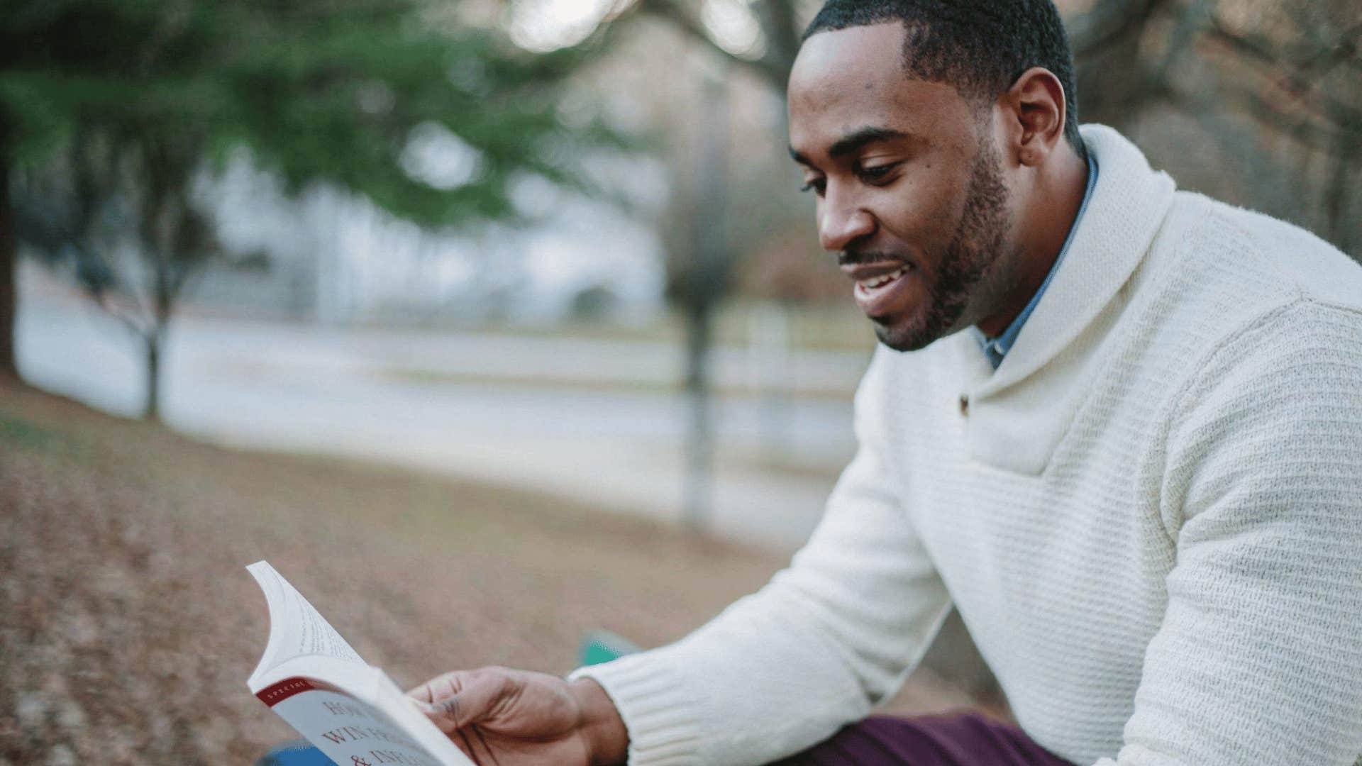 successful man reading a book