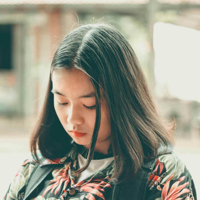 sad woman looking down 