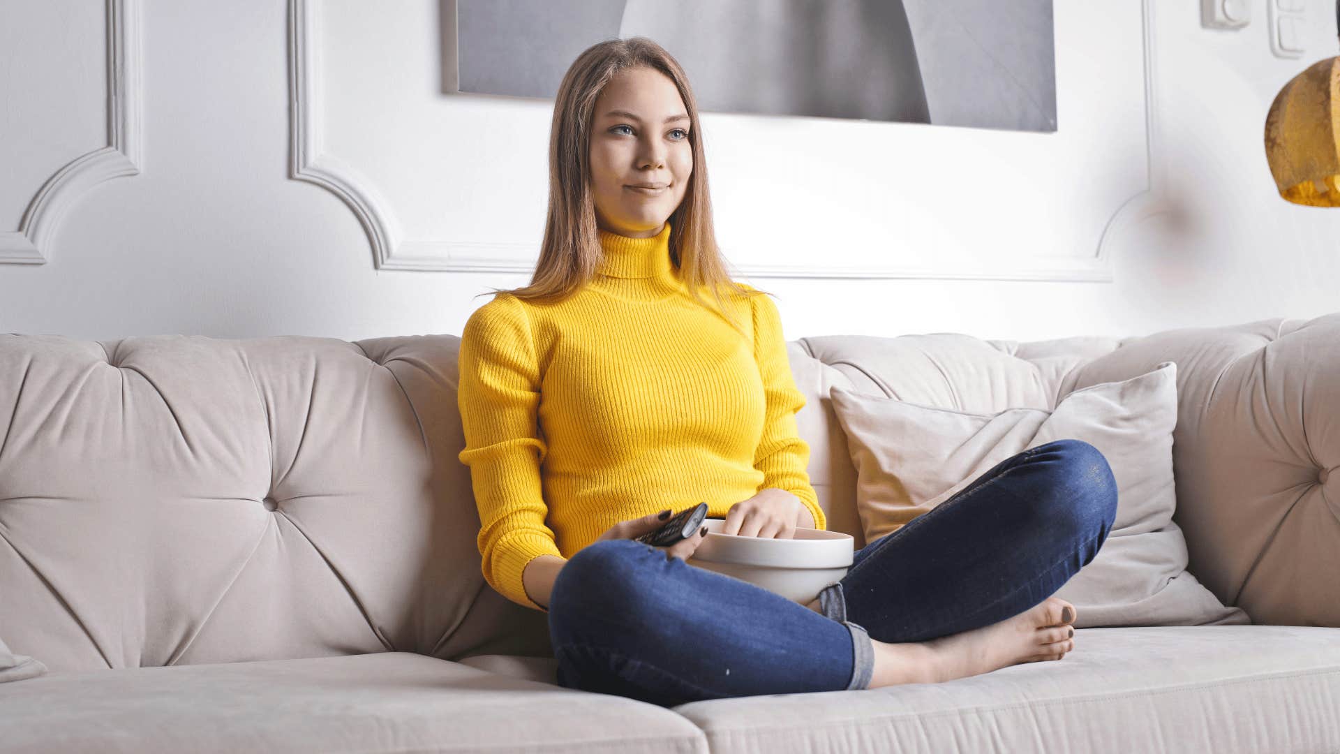 woman in yelling sitting on couch