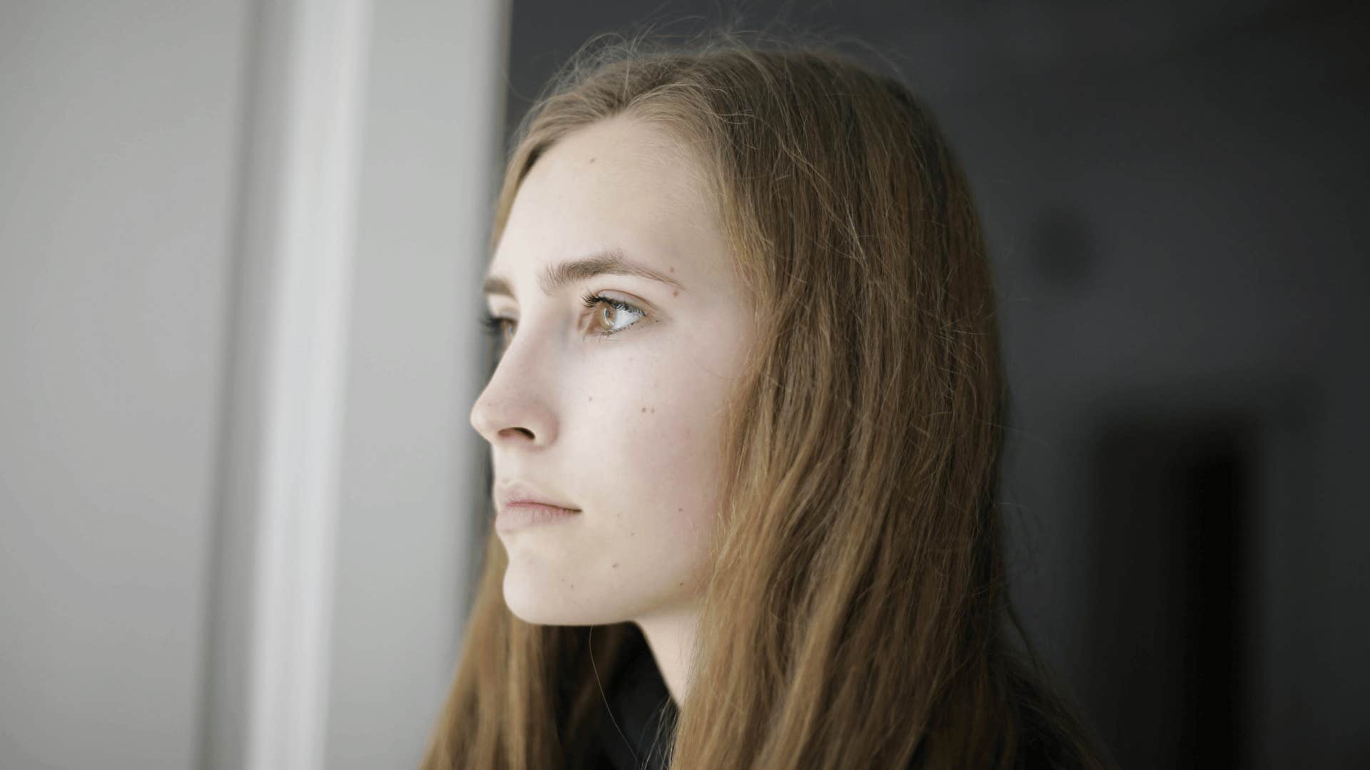woman thinking about her shortcomings