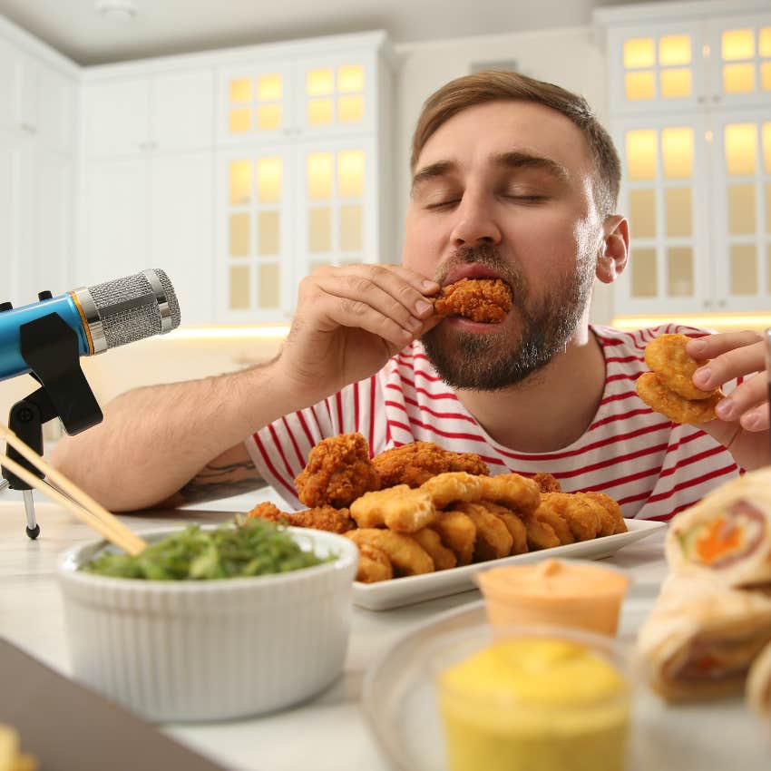 Mukbang creator filming himself eating online food trends. 