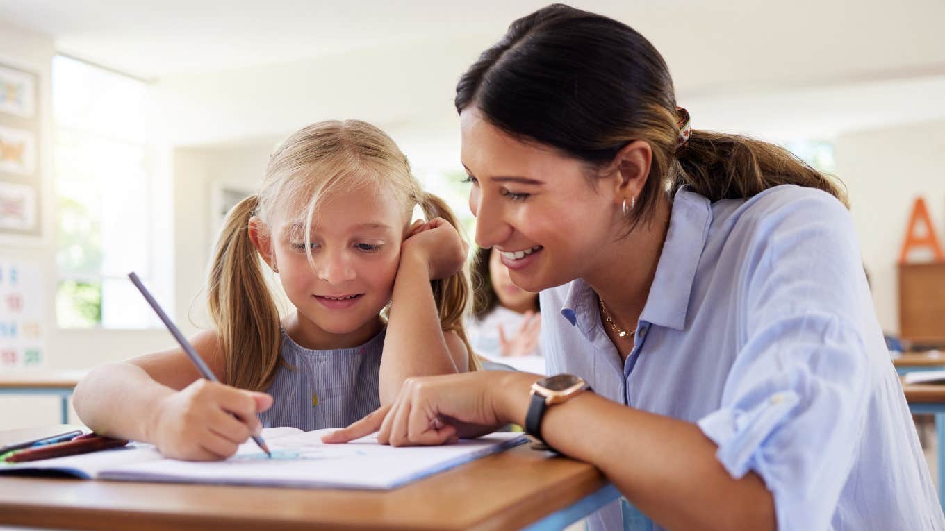 Teacher helping an underperforming student in class. 