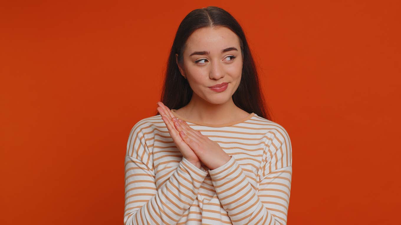 4 Ways To Get Revenge Without Getting In Trouble, According To An Attorney Sneaky woman plotting revenge