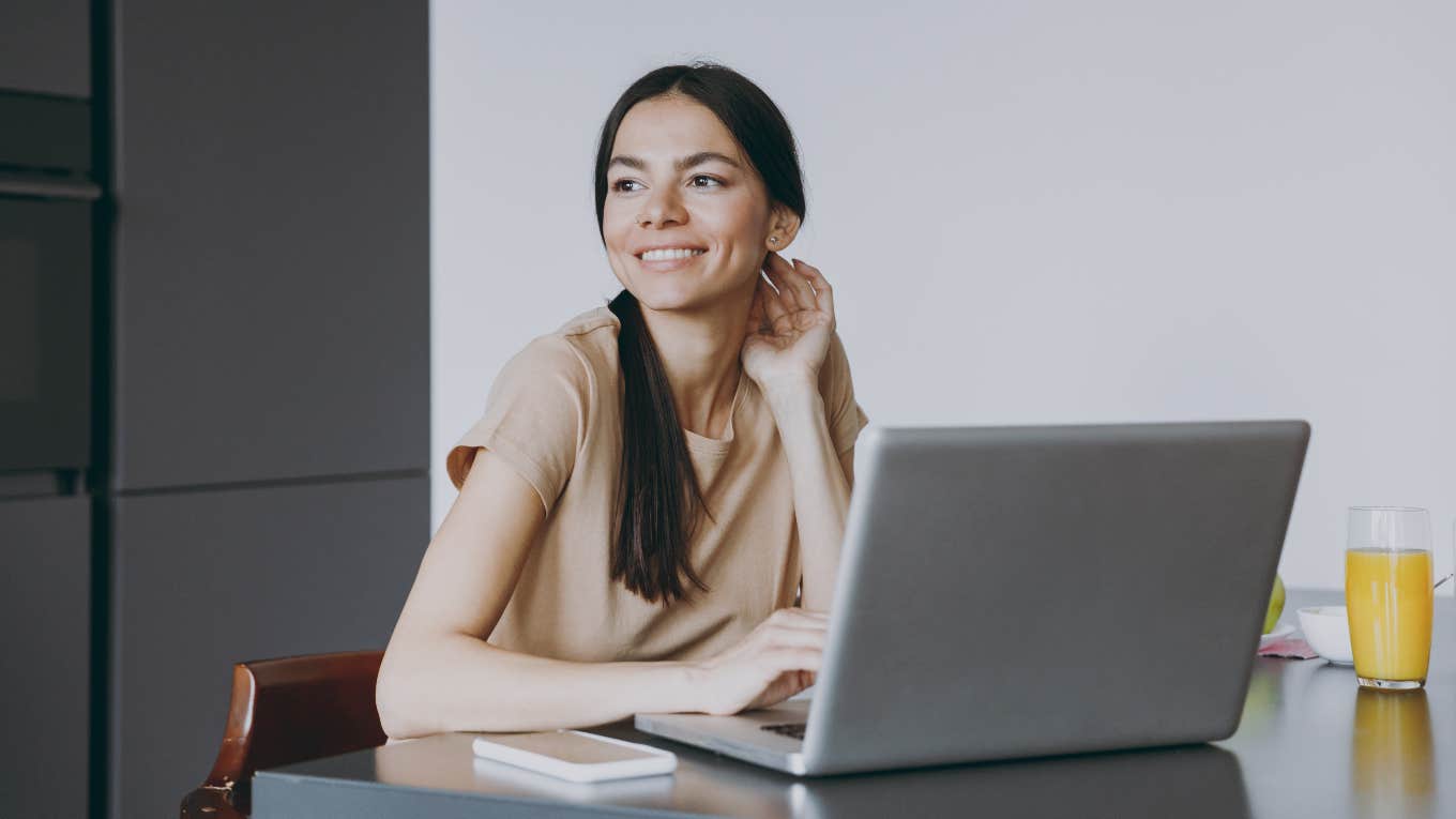 Gen-Z Career Expert Says That A Job Does Not Need To Align With Your Purpose Happy woman working on computer