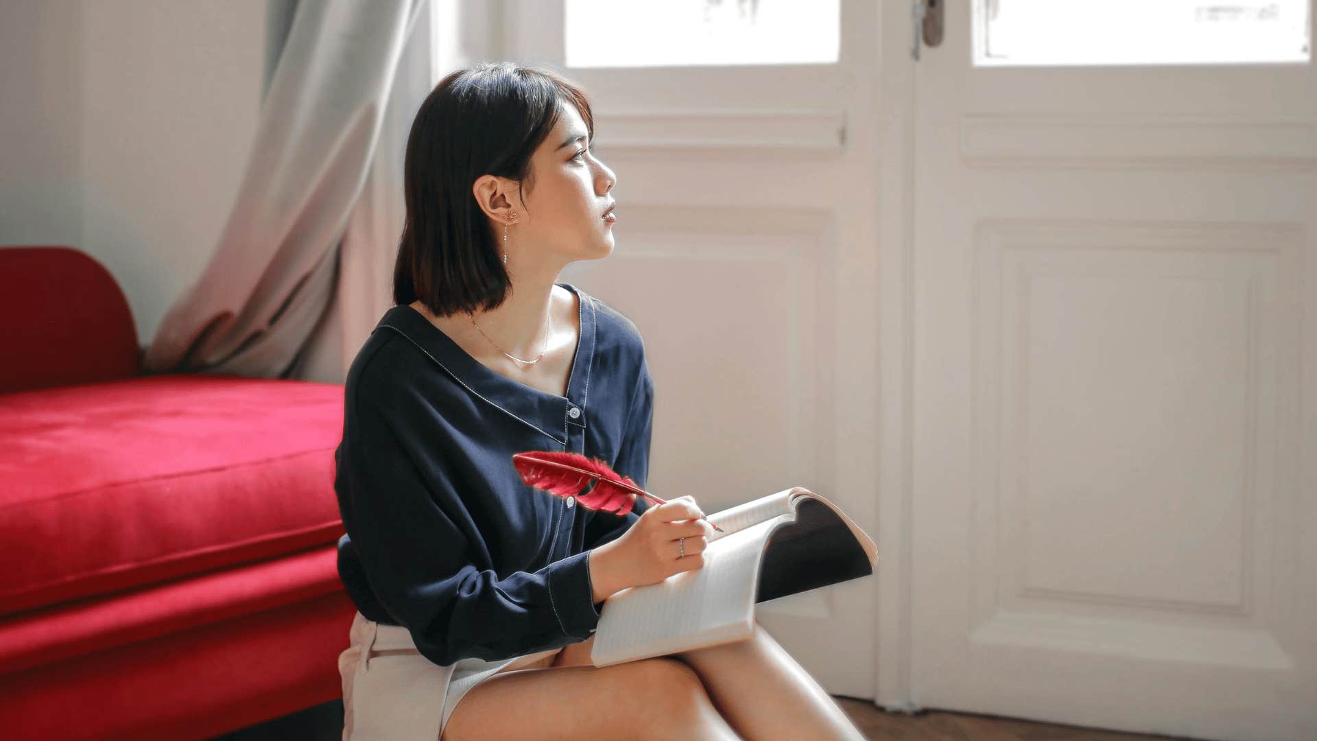 woman writing out goals
