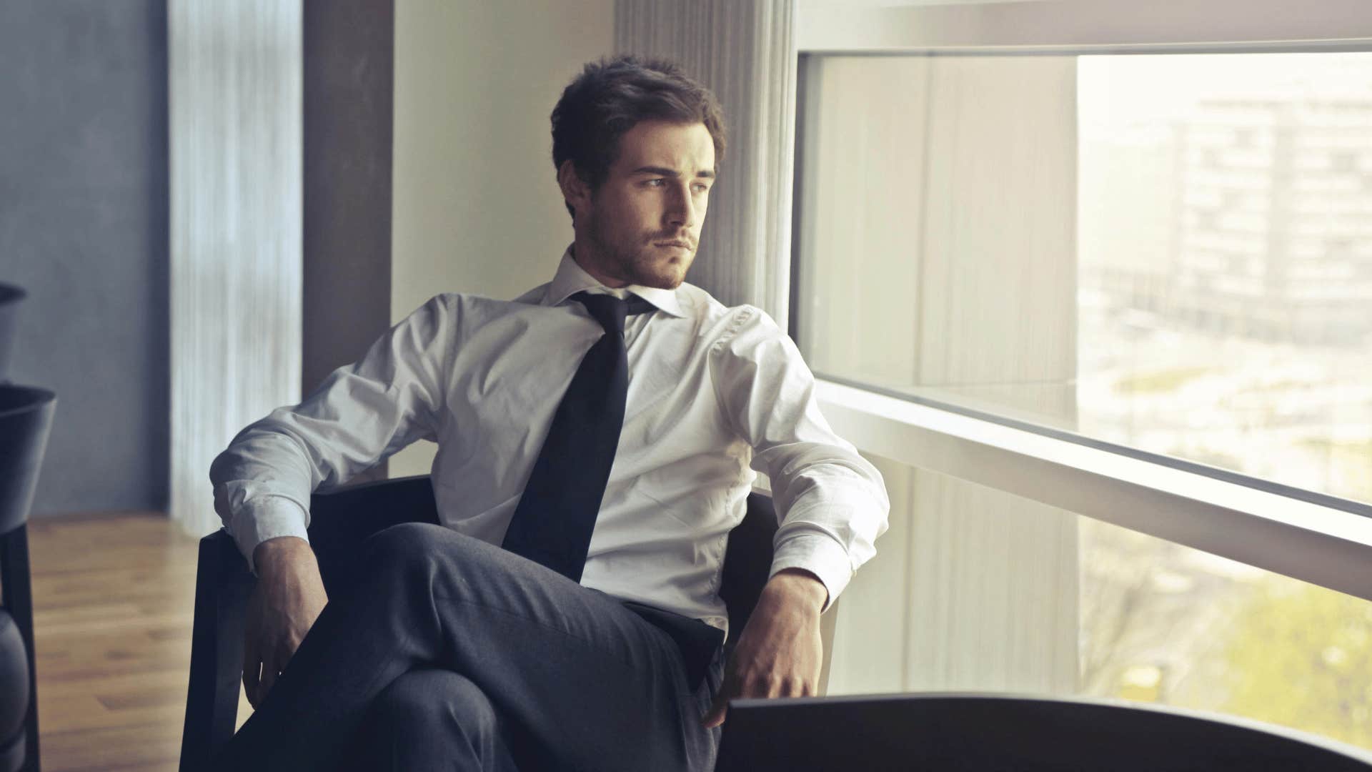 businessman looking outside window