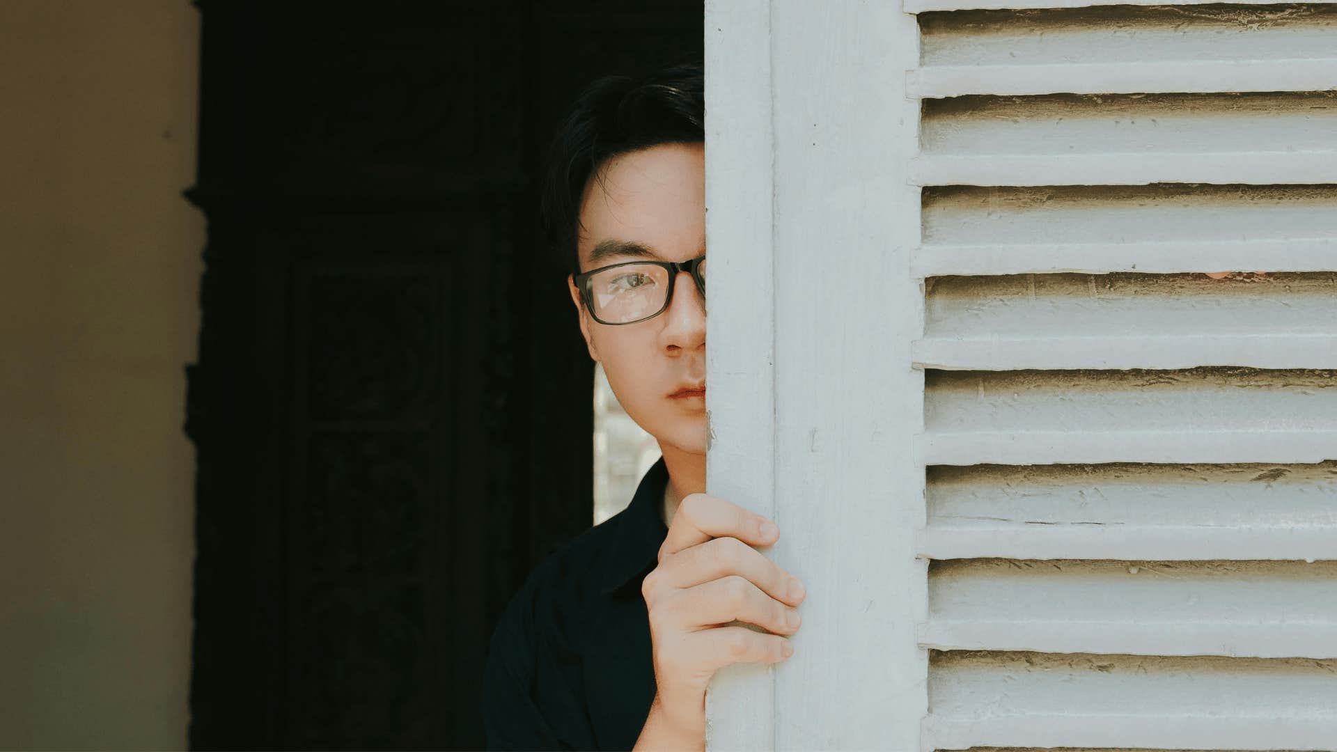 man hiding in closet