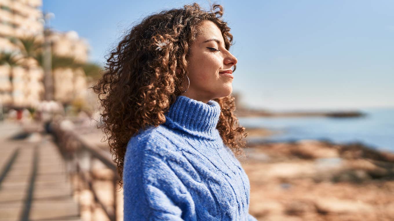 Tiny Habits Of Incredibly Lucky People woman feeling free and lucky