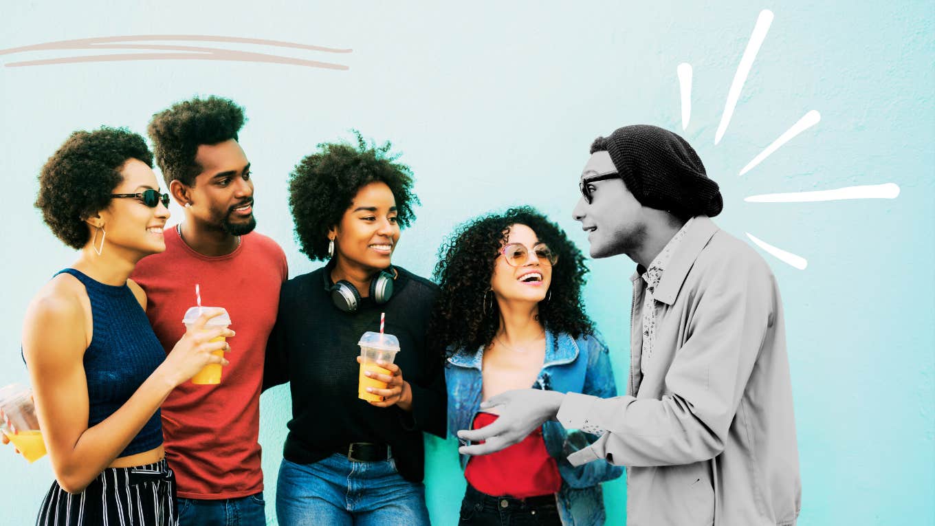 Socially confident man, engaging with a group of others