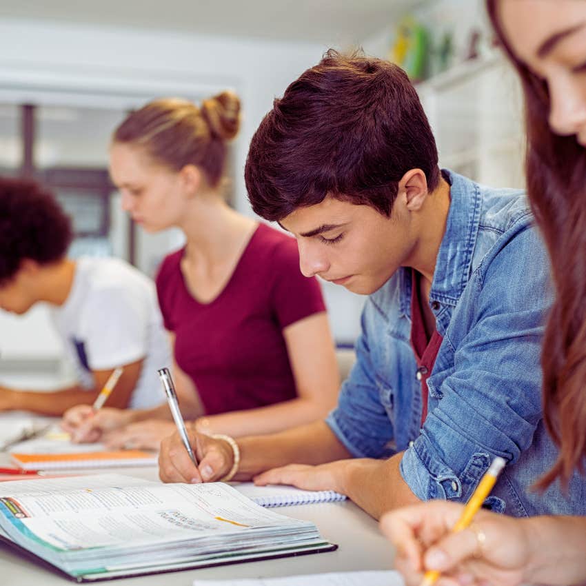 high school students working on assignment in class