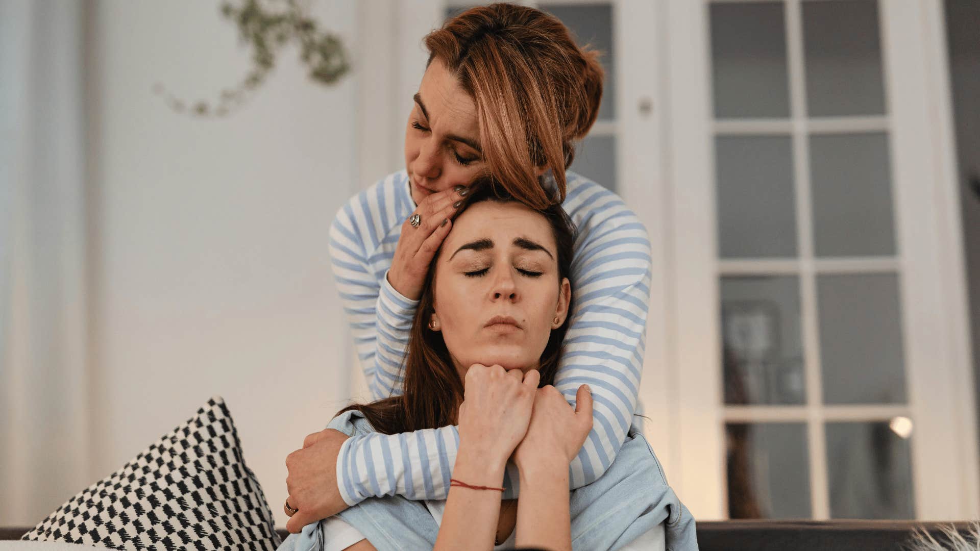 woman comforting friend sadness