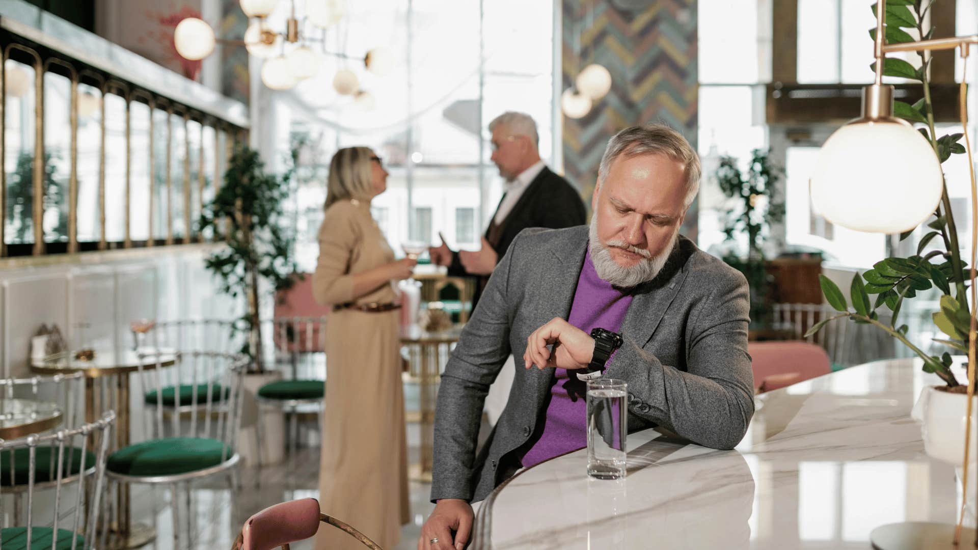 punctual man waiting looking at watch