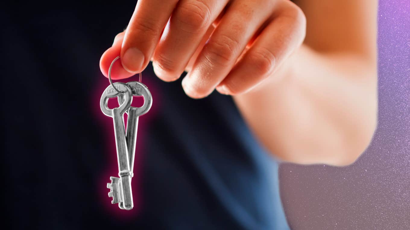 The Key To Overcoming A Painful Divorce Woman hold the key to overcoming a painful divorce.