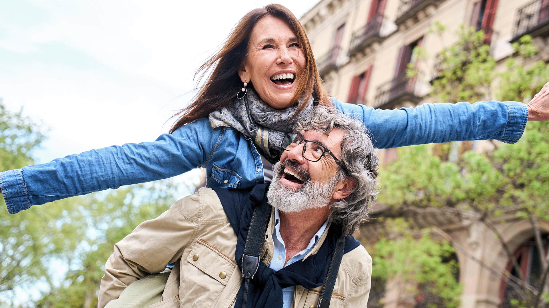 older couple having fun and laughing outside
