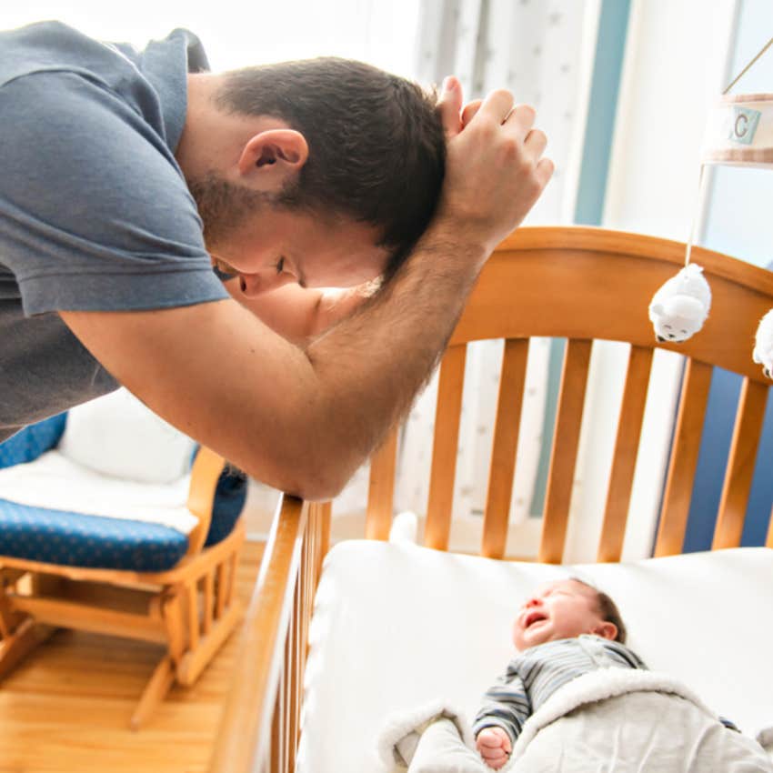 man with crying baby 