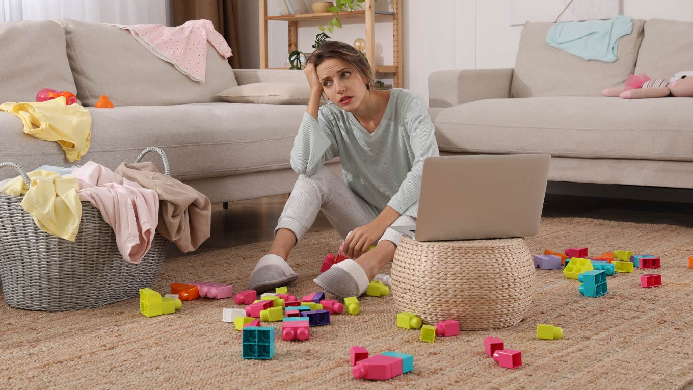Mom Asks How To Keep Her House Clean After A 4-Year-Old Called Her Home Dirty mom picking up toys in living room