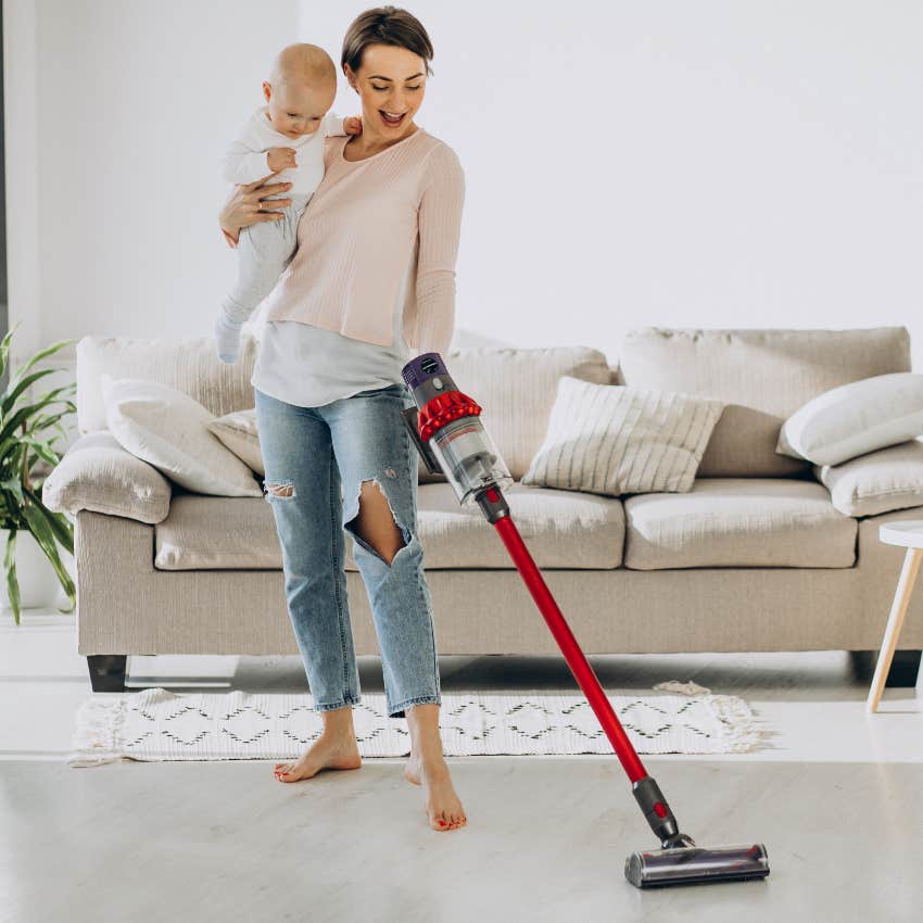 Mom vacuuming with her baby