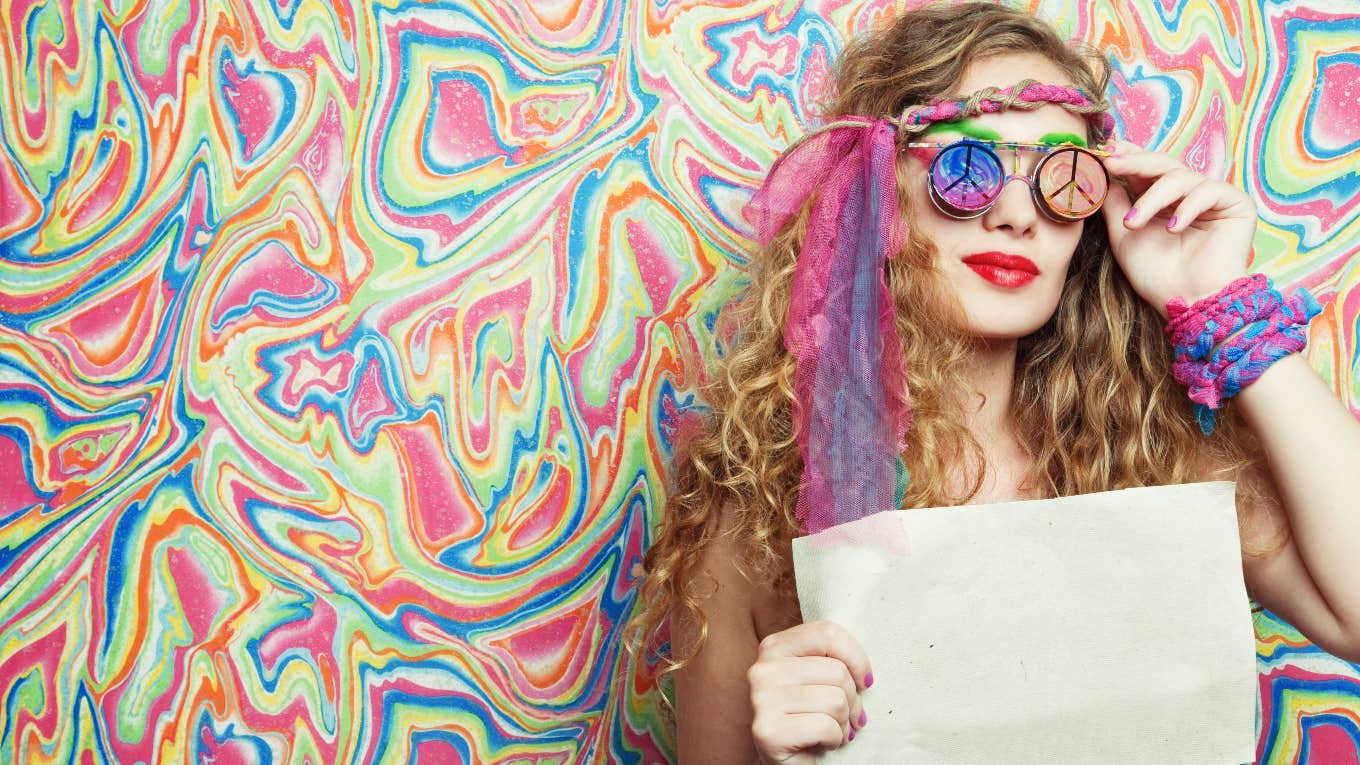 Neuroscientist's Explains Why Psychedlics Should Be Legal hippie woman holding paper