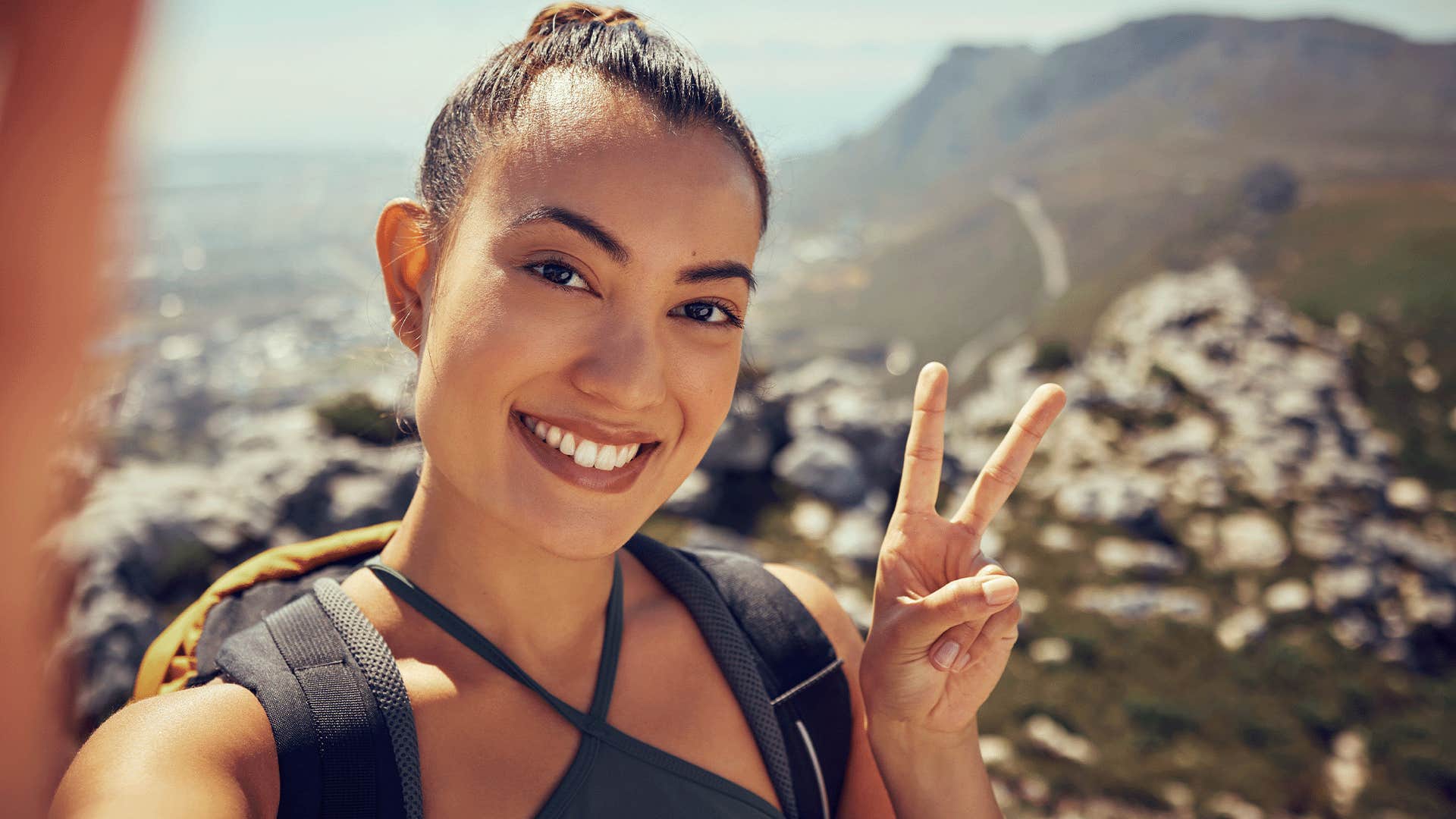happy woman taking a selfie outdoors