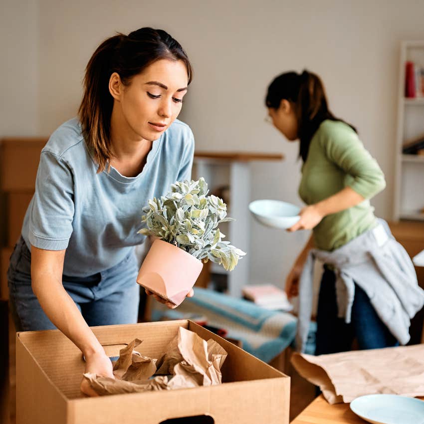 Roommates unpacking together after living alone. 
