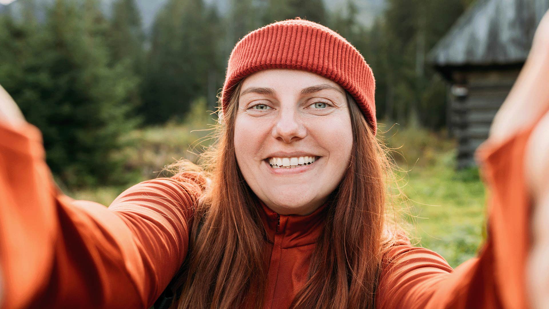 happy woman taking a selfie outdoors