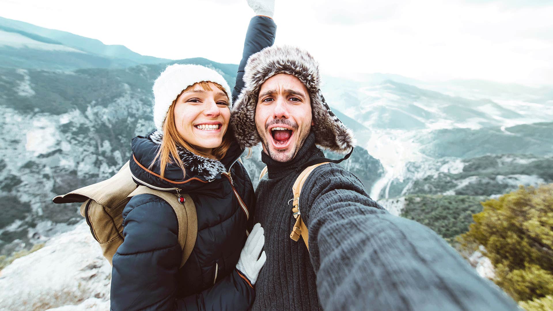 happy woman taking a selfie outdoors